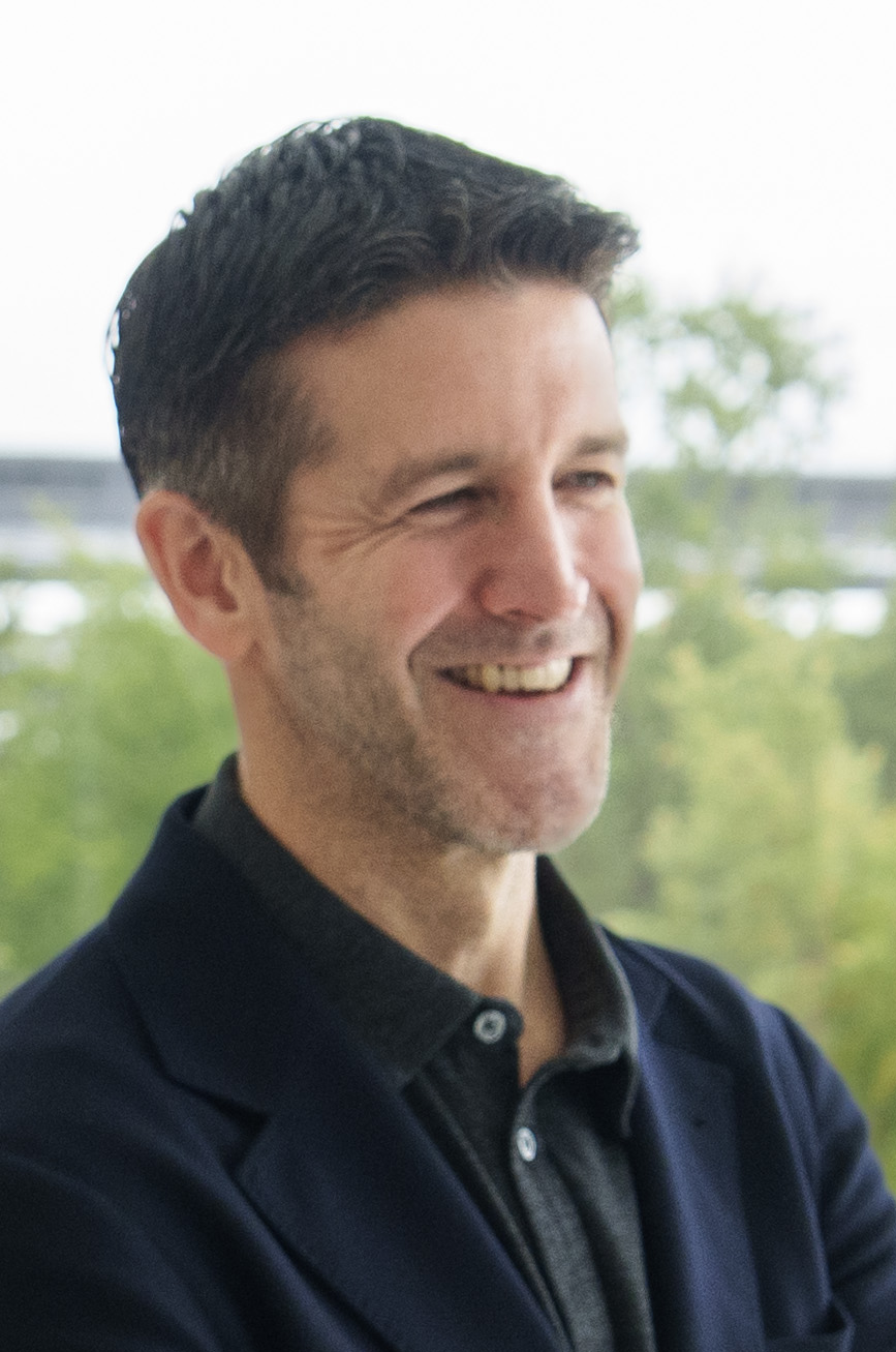 John Ternus smiling, photographed in San Francisco in May 2026